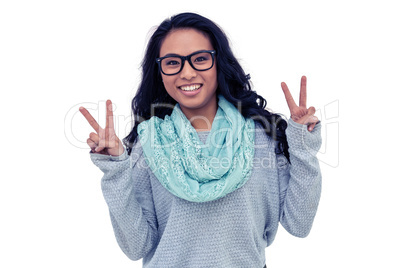 Asian woman making peace sign with hand