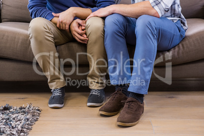 Gay couple relaxing on the couch