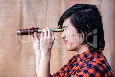 Hipster looking through a telescope