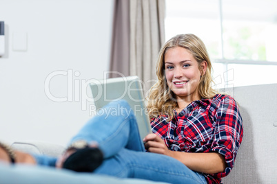 Woman using tablet computer