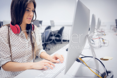 Serious student working on computer