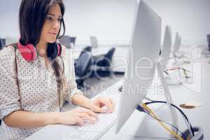 Serious student working on computer