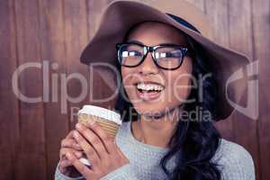 Asian woman holding disposable cup