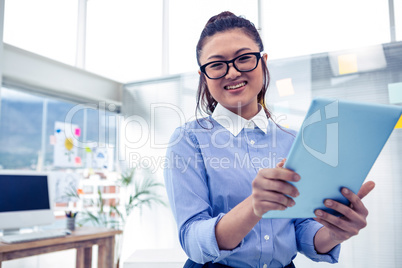 Asian businesswoman using tablet