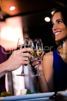 Couple toasting with a glass of wine