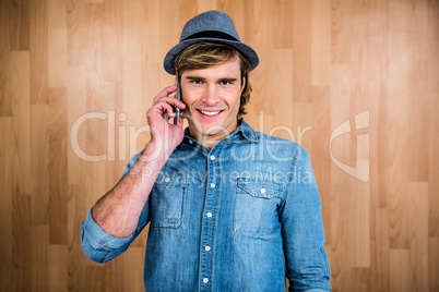 Smiling blonde hipster phone calling