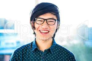 Smiling hipster businessman looking at camera