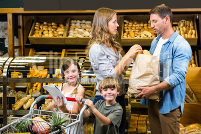 Happy family doing shopping