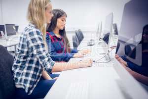 Concentrated students using computer