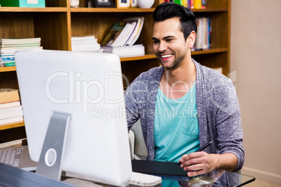 Smiling designer using tablet graphic