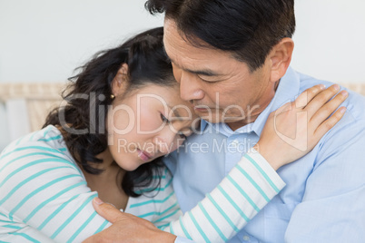 Sad couple embracing