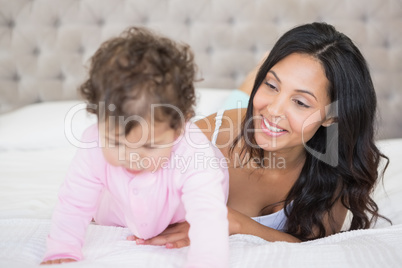 Brunette playing with her baby