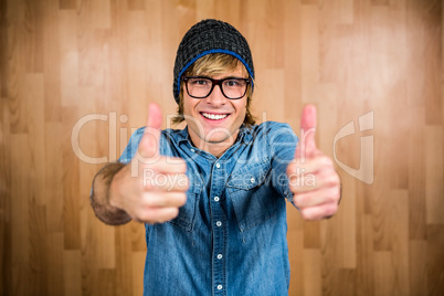 Smiling hipster with thumbs up