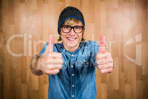 Smiling hipster with thumbs up