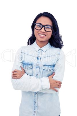 Asian woman with arms crossed smiling