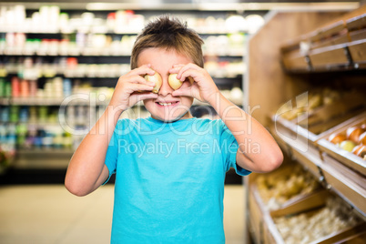 Little boy playing with products