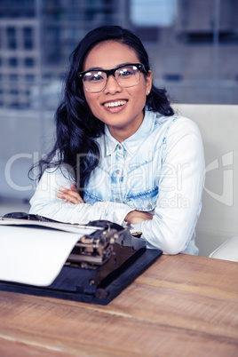 Asian woman typewriting