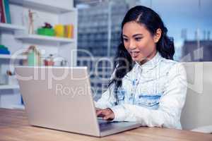 Asian woman using laptop