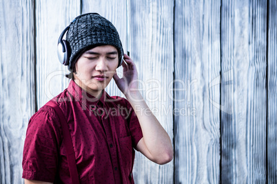 Hipster listening music with headphone