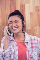 Happy Asian woman on phone call