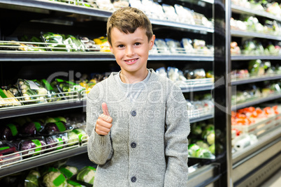 Cute boy with thumbs up