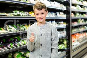 Cute boy with thumbs up