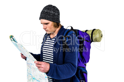 Backpacker looking a map