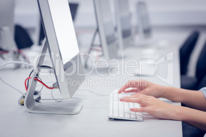 Cropped image of student working on computer