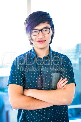 Hipster businessman with crossed arms