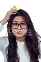 Asian woman with paper crown posing for the camera