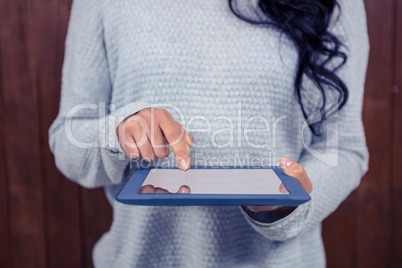 Mid section of Asian woman using tablet