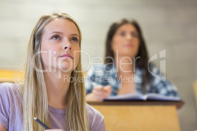 Students sitting beside each other while learning