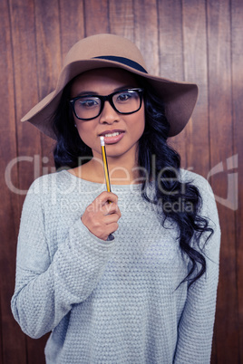 Asian woman holding pencil