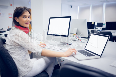 Smiling student working on computer