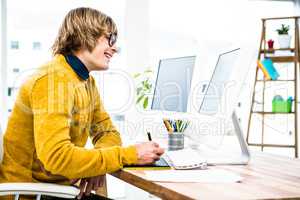 Side view of hipster businessman using tablet graphic