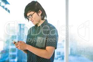 Creative businessman using smartphone