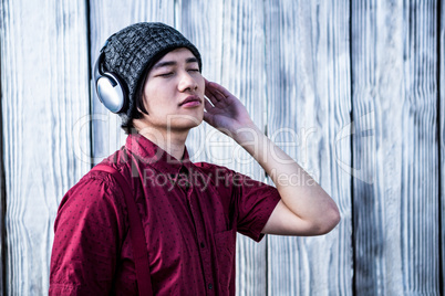 Hipster listening music with headphone