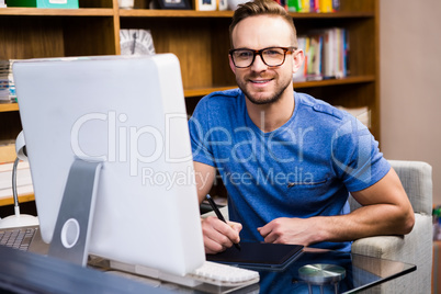 Smiling designer using tablet graphic