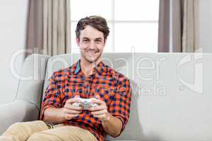 Happy man playing video games