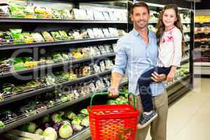 Father and daughter doing grocery shopping
