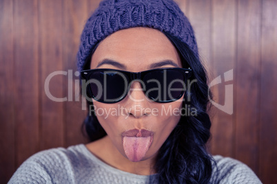 Asian woman sticking out her tongue