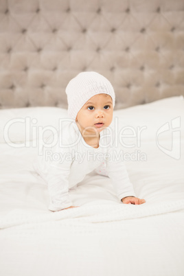 Smiling baby on bed