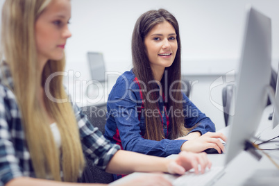 Smiling student working on computer