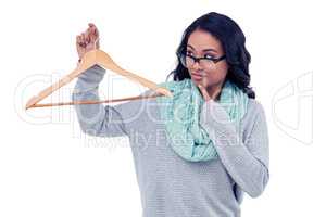 Asian woman holding wooden hanger