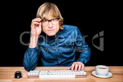 Focused hipster businessman using computer