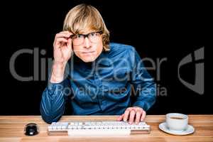 Focused hipster businessman using computer