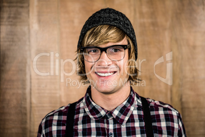 Happy blond hipster smiling