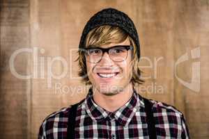 Happy blond hipster smiling
