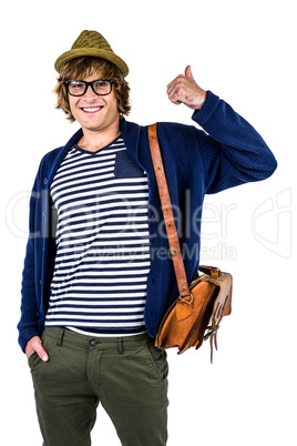 Smiling hipster making thumbs up