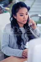 Pretty Asian woman on phone call